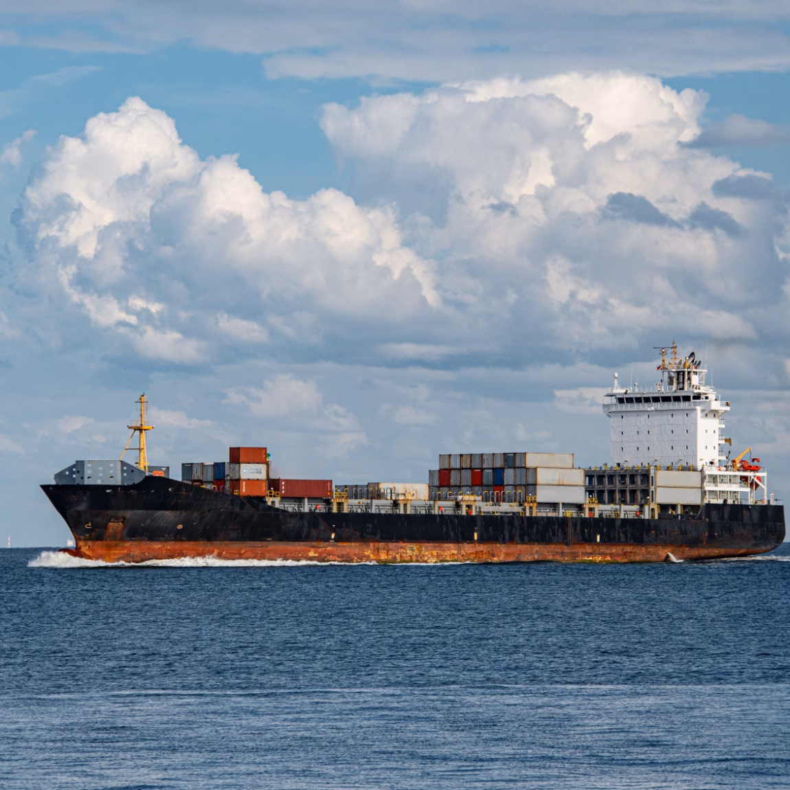 A cargo ship transports containers by sea for international freight transport.