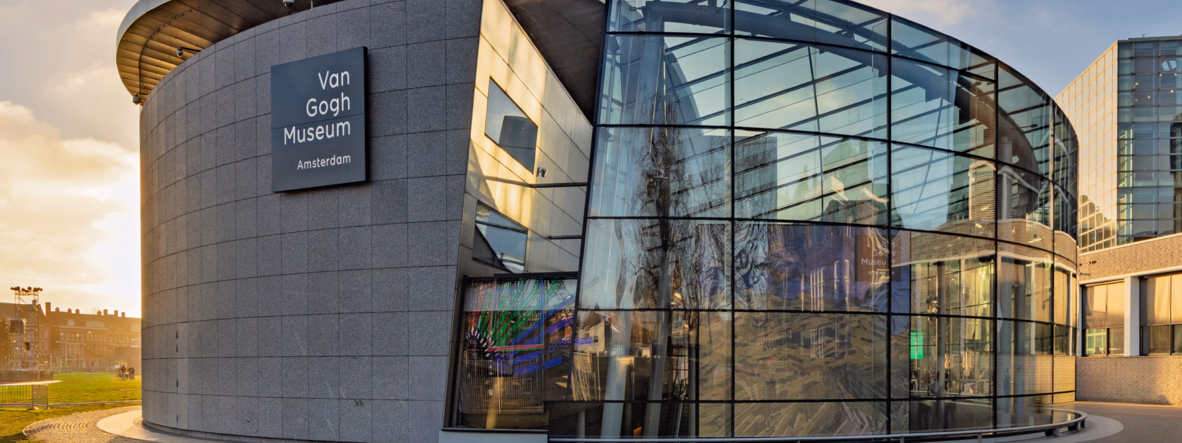 A modern museum building with striking architecture and a transparent glass facade.