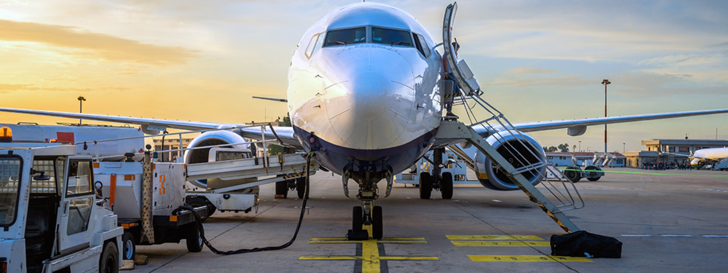 A passenger plane is being prepared for departure during ground handling operations at the airport.