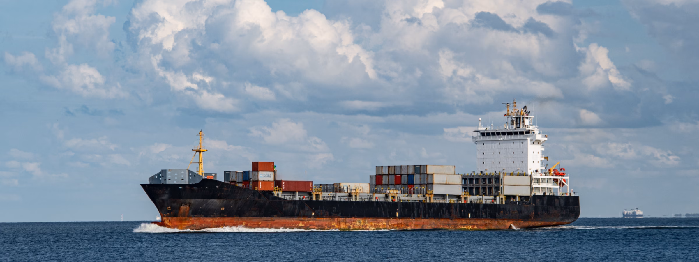 A cargo ship transports containers by sea for international freight transport.