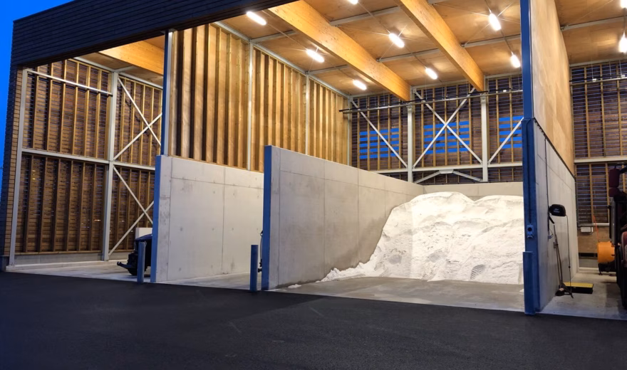 A covered storage facility for the safe storage of bulk materials at an industrial site.