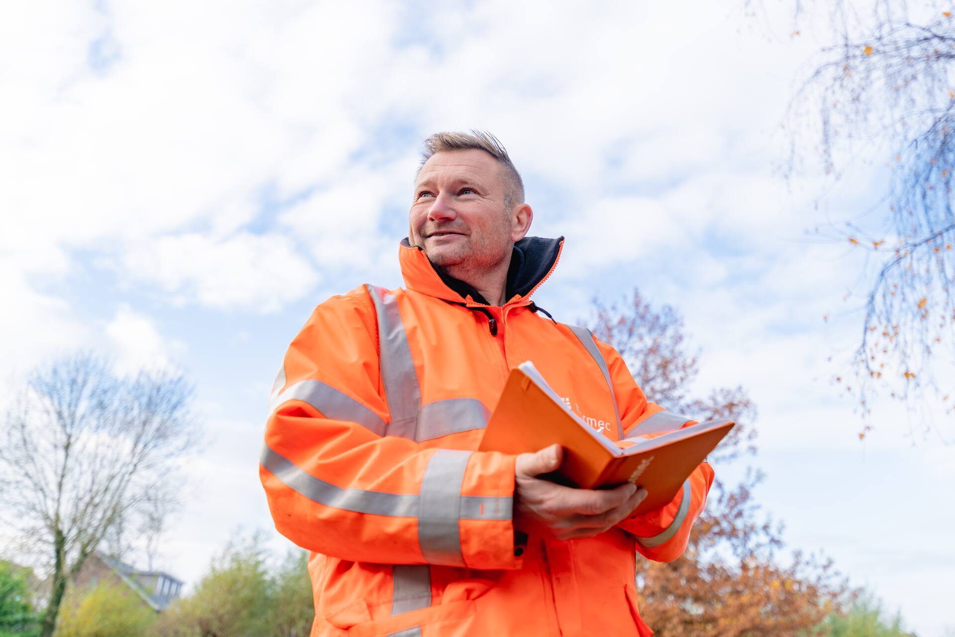 An inspector performs inspection and audit tasks on-site and records findings.