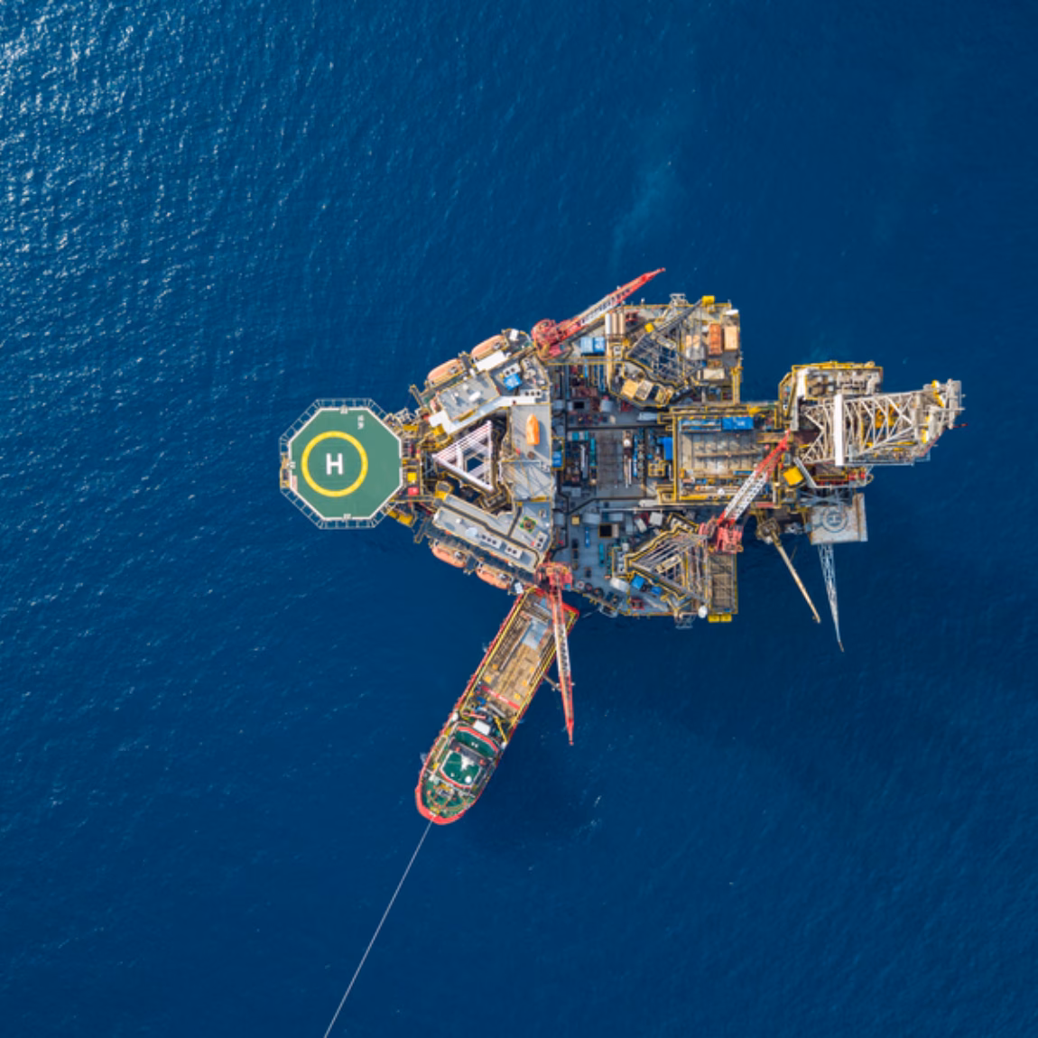 Aerial view of an offshore installation in the open sea used for industrial activities.
