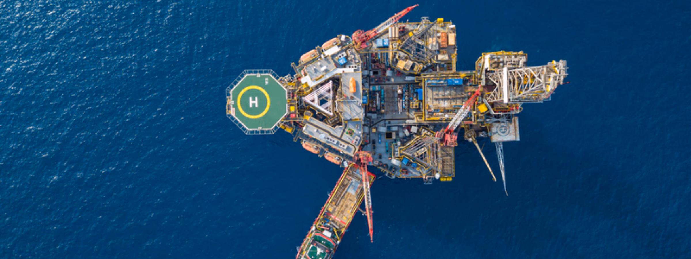 Aerial view of an offshore installation in the open sea used for industrial activities.