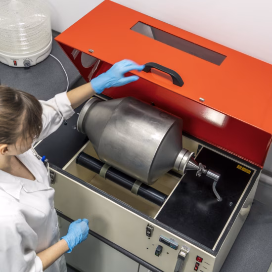 A laboratory technician prepares samples for analysis using specialized laboratory equipment.