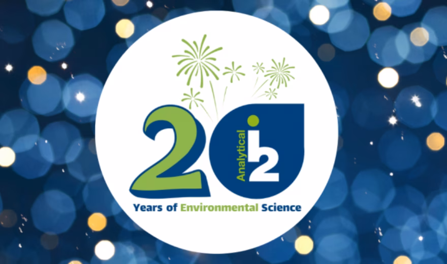 Logo celebrating 20 years of Environmental Science, featuring the number 20, green fireworks accents, and a blue background with circles of light.