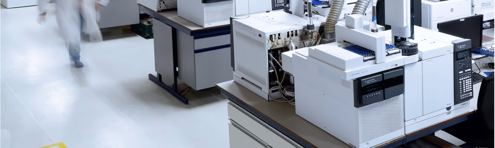 Modern laboratory with automated analytical equipment for research and quality control.
