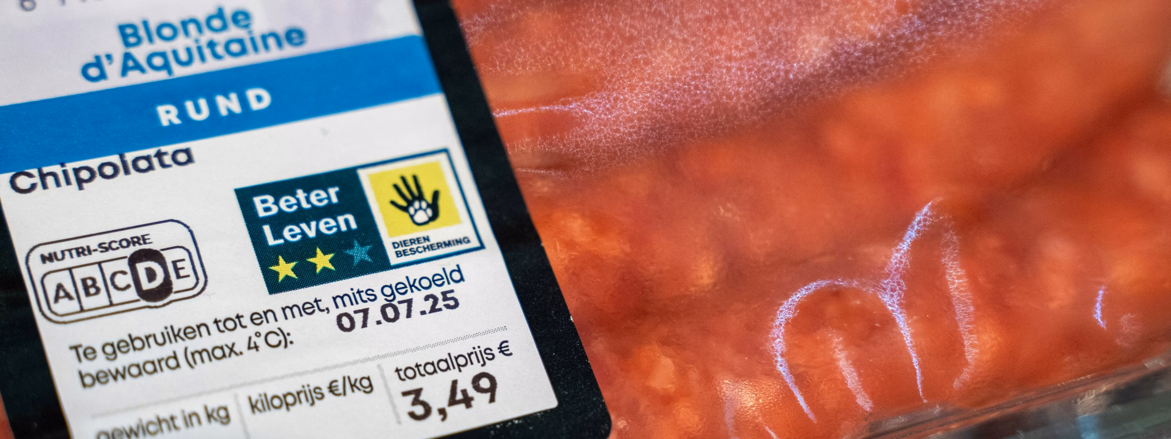 Close-up photo of packaged beef chipolata with product information and nutrition label.