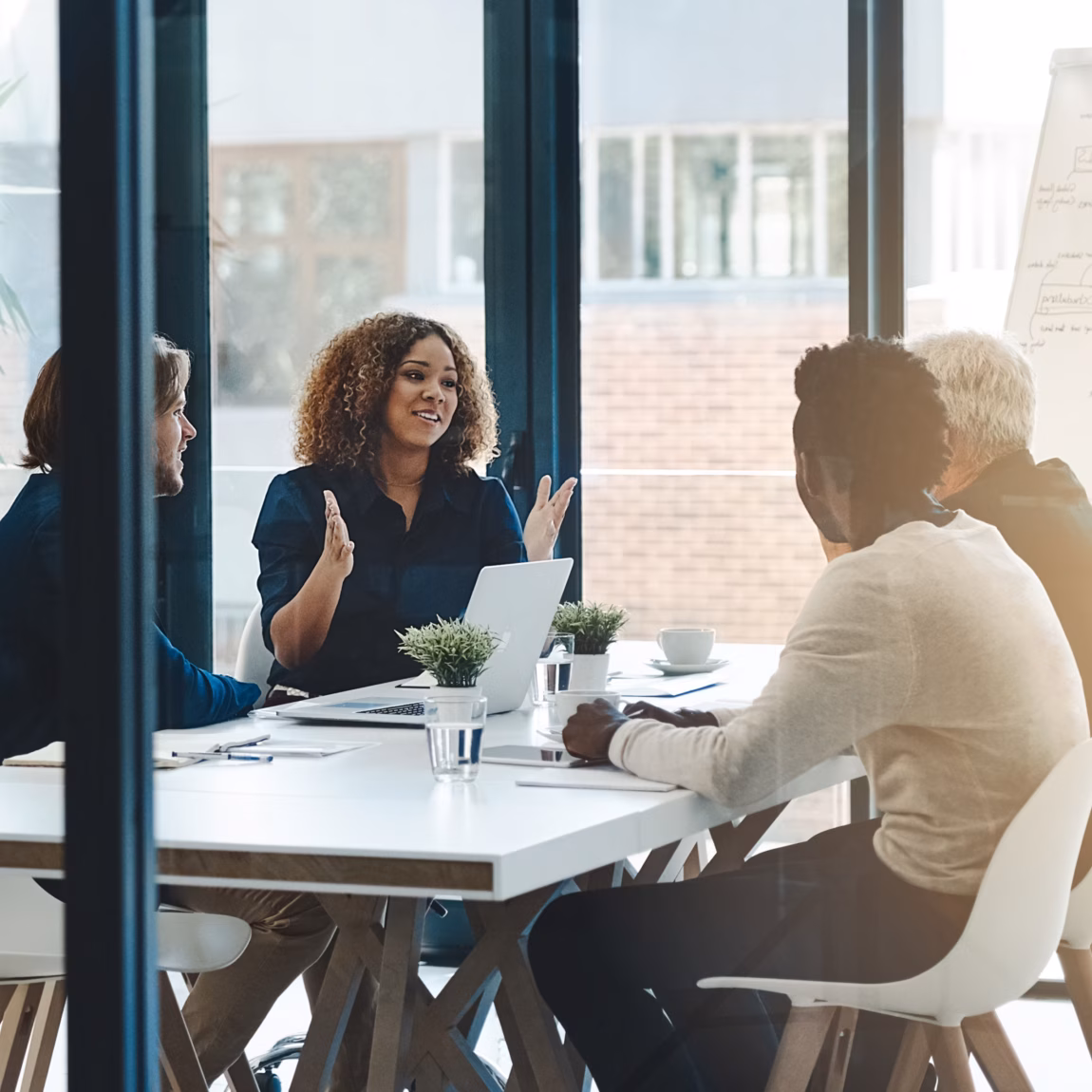 Planning, teamwork and meeting with business people in boardroom for strategy, brainstorming and solution. Corporate, collaboration and conference with employees in office for negotiation development.