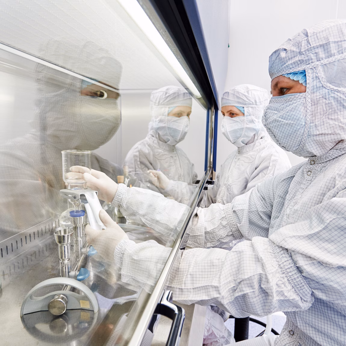 female science researcher in protective uniform and equipment works with dangerous hazard virus material at microbilogy laboratory