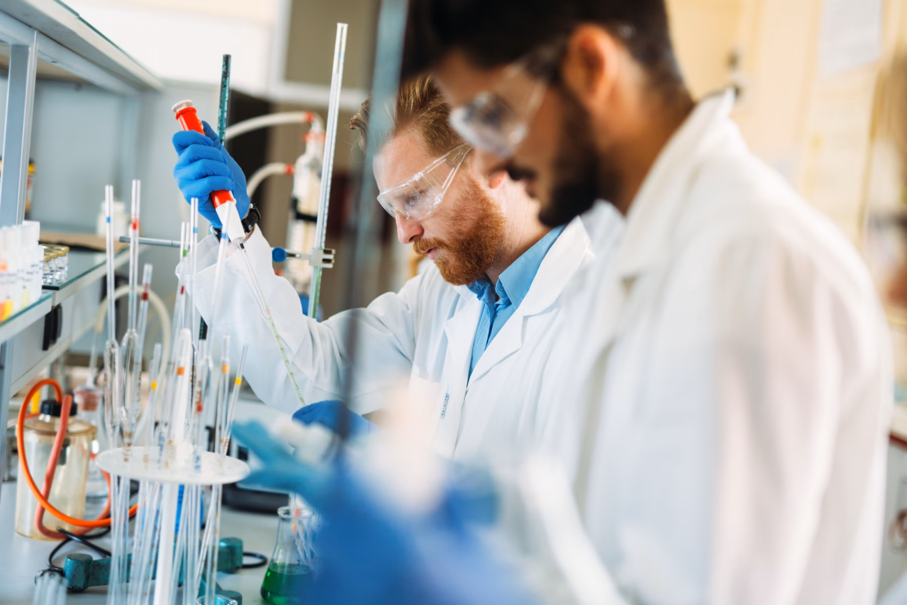 Young students of chemistry working together in laboratory