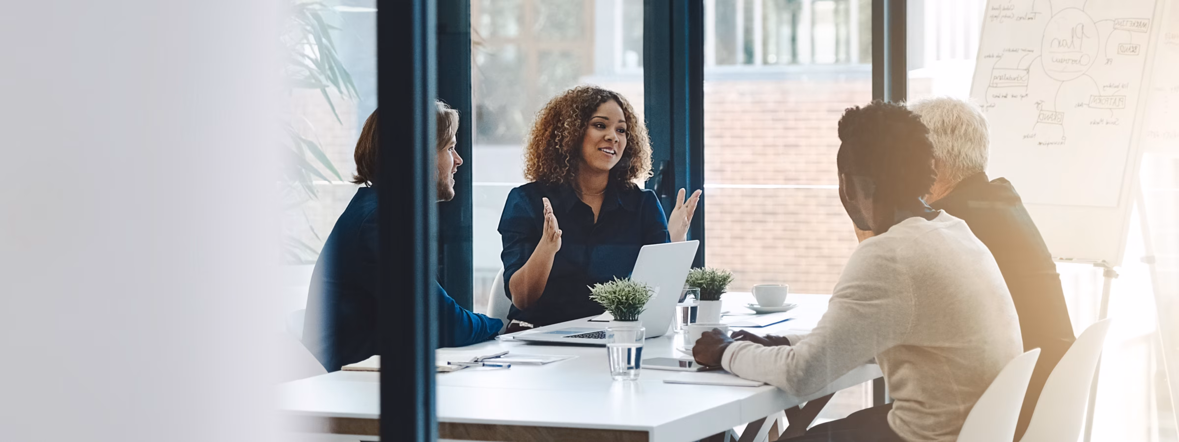 Planning, teamwork and meeting with business people in boardroom for strategy, brainstorming and solution. Corporate, collaboration and conference with employees in office for negotiation development.