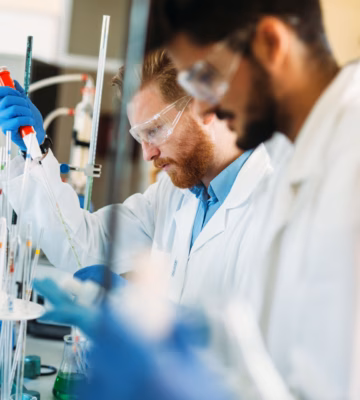 Young students of chemistry working together in laboratory