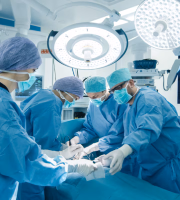 Medical Team Performing Surgical Operation in Bright Modern Operating Room