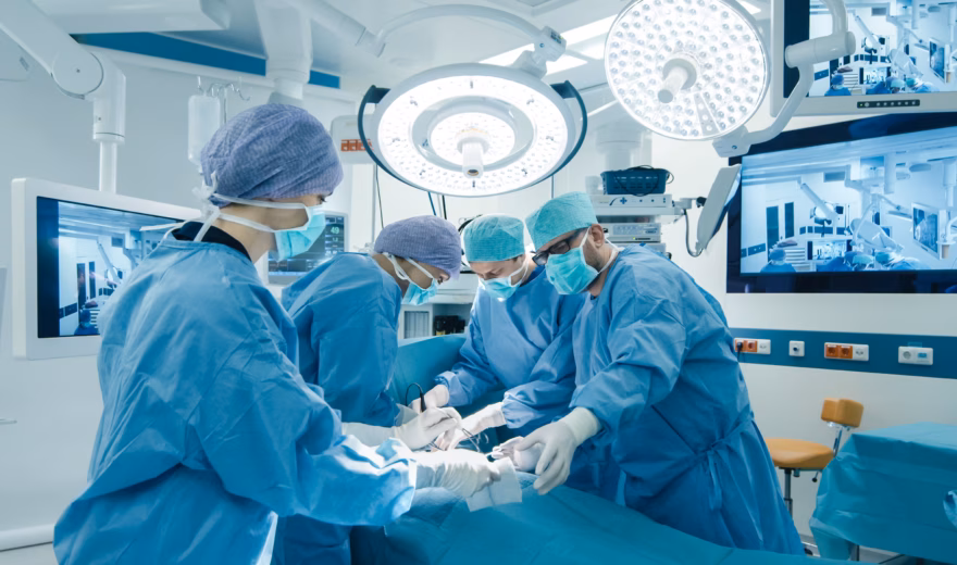 Medical Team Performing Surgical Operation in Bright Modern Operating Room