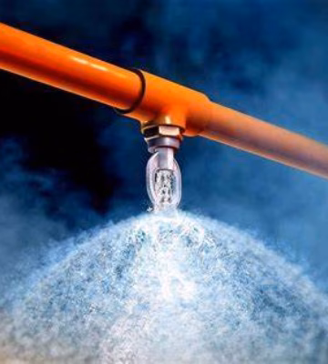 A sprinkler system disperses water as part of a fire protection system.
