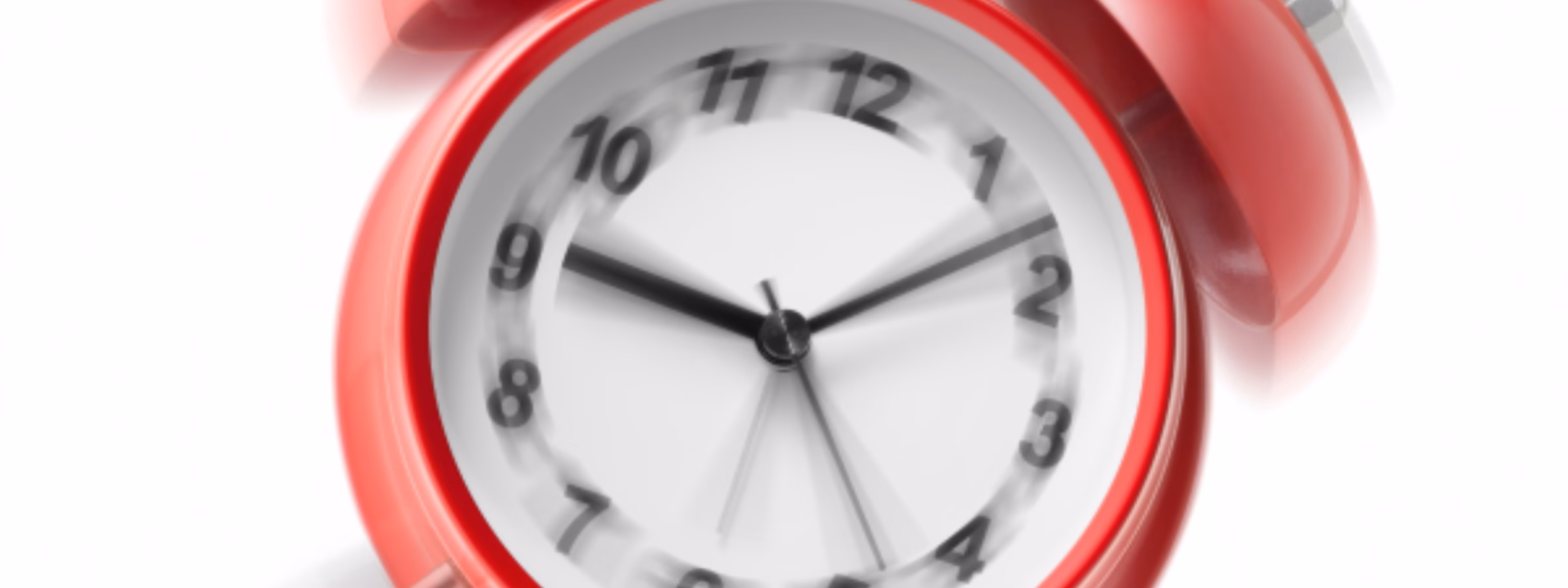 Ein roter, sich bewegender Wecker mit einer Glocke und kaum sichtbaren Zeigern, der schnelle Durchlaufzeiten, effizientes Projektmanagement, reaktionsschnellen Kundenservice und schnelle Lösungen in den Bereichen Prüfung und Konformität symbolisiert.