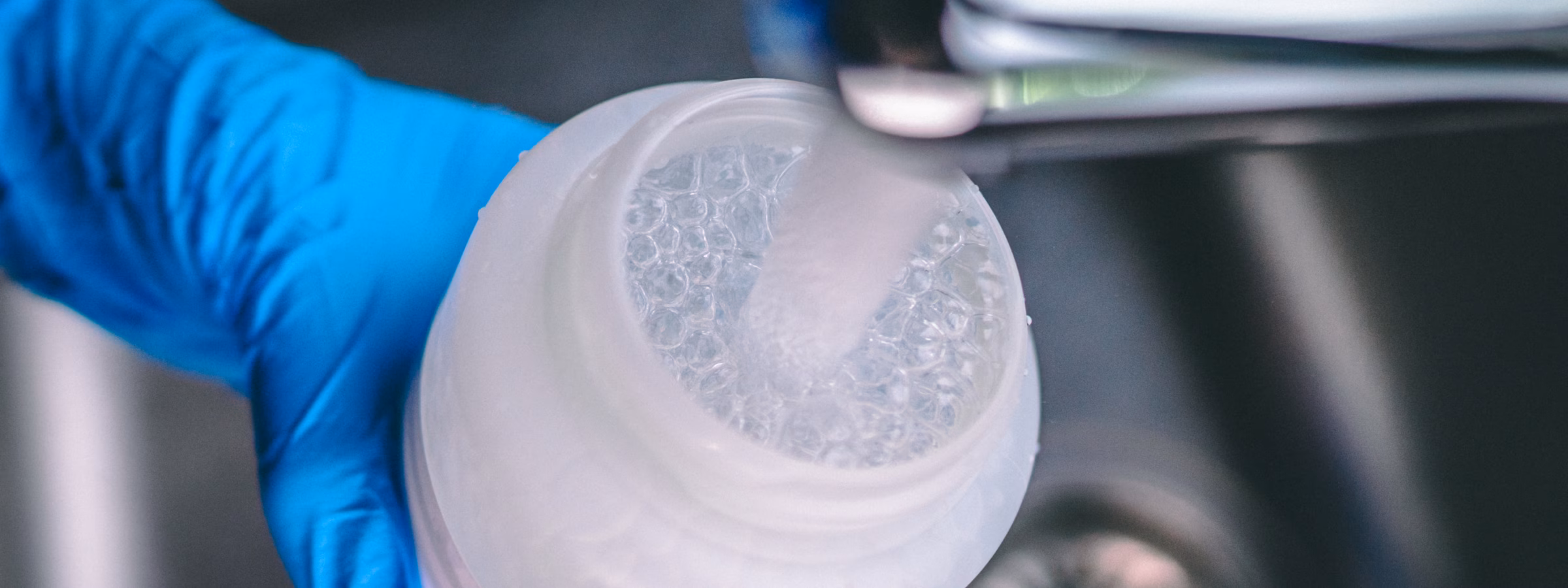 A water sample is collected for water quality analysis in the laboratory.