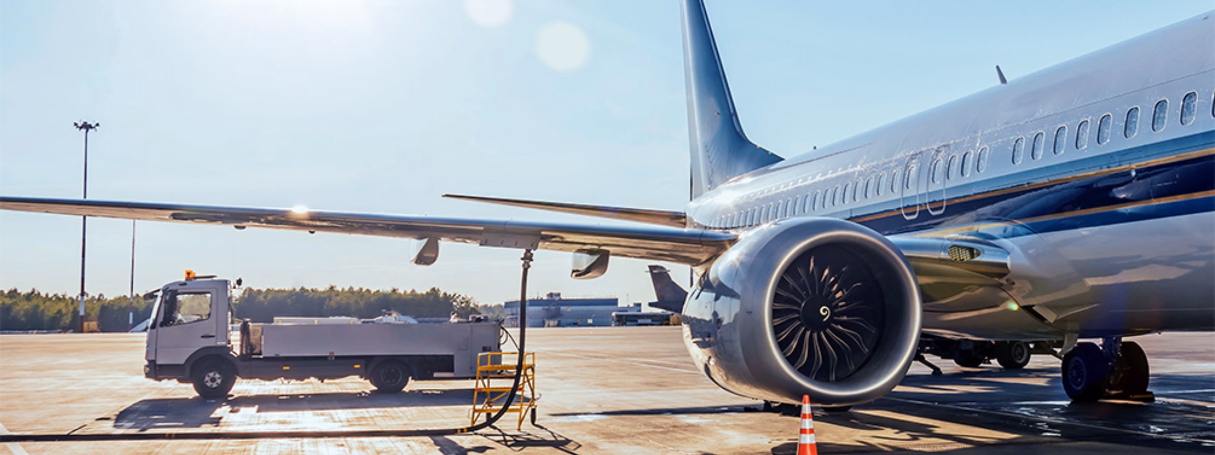 An airplane is on the airport apron while ground handling operations are being carried out.