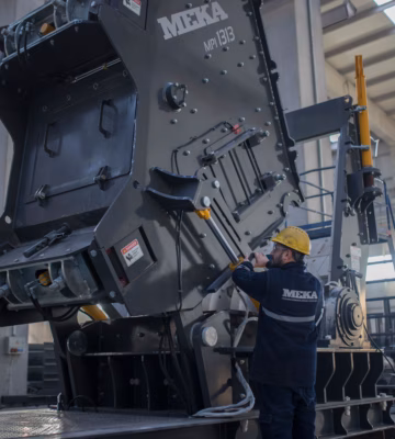 Industrial inspector performs an inspection on a large mechanical power press inside a manufacturing facility, highlighting machine safety assessments, equipment certification, regulatory compliance, preventive maintenance, and quality assurance for industrial production machinery and manufacturing operations.