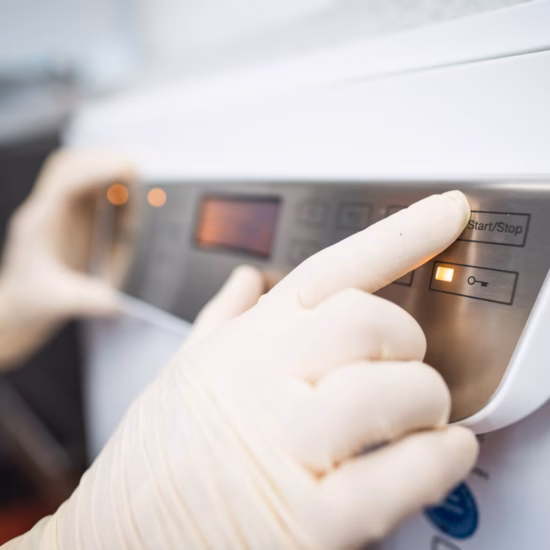 “Medical staff using medical laboratory equipment to perform clinical tests and analyses.”