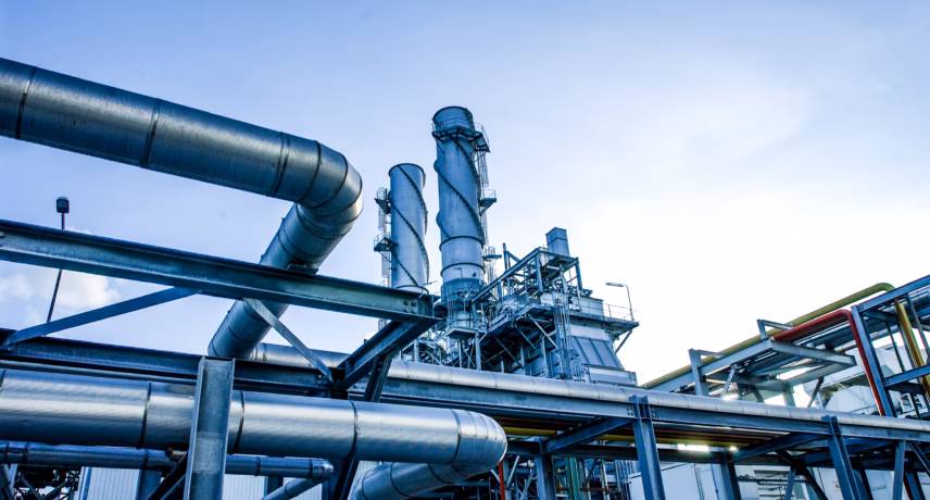 Industrial plant with piping and process equipment for production and processing operations.