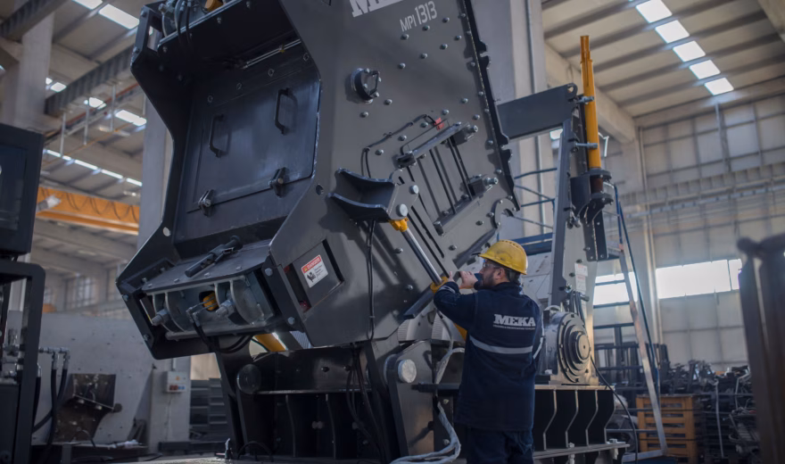 Industrial inspector performs an inspection on a large mechanical power press inside a manufacturing facility, highlighting machine safety assessments, equipment certification, regulatory compliance, preventive maintenance, and quality assurance for industrial production machinery and manufacturing operations.